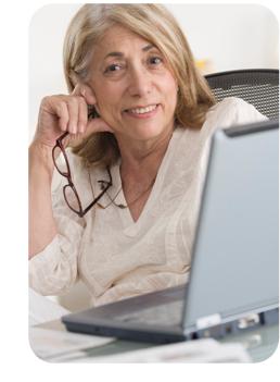 Downloadable eBooks-Woman Reading eBook on Laptop